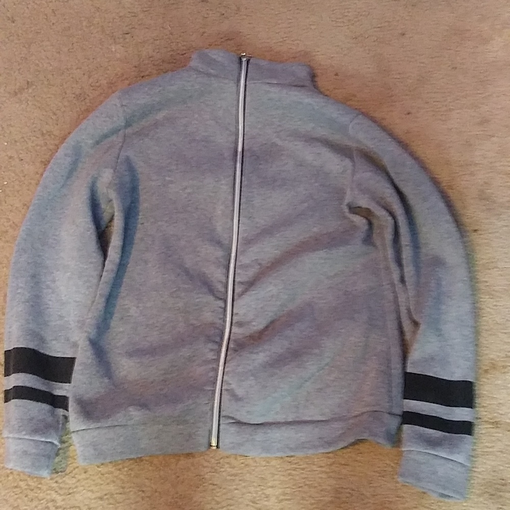 A gray zip up sweater